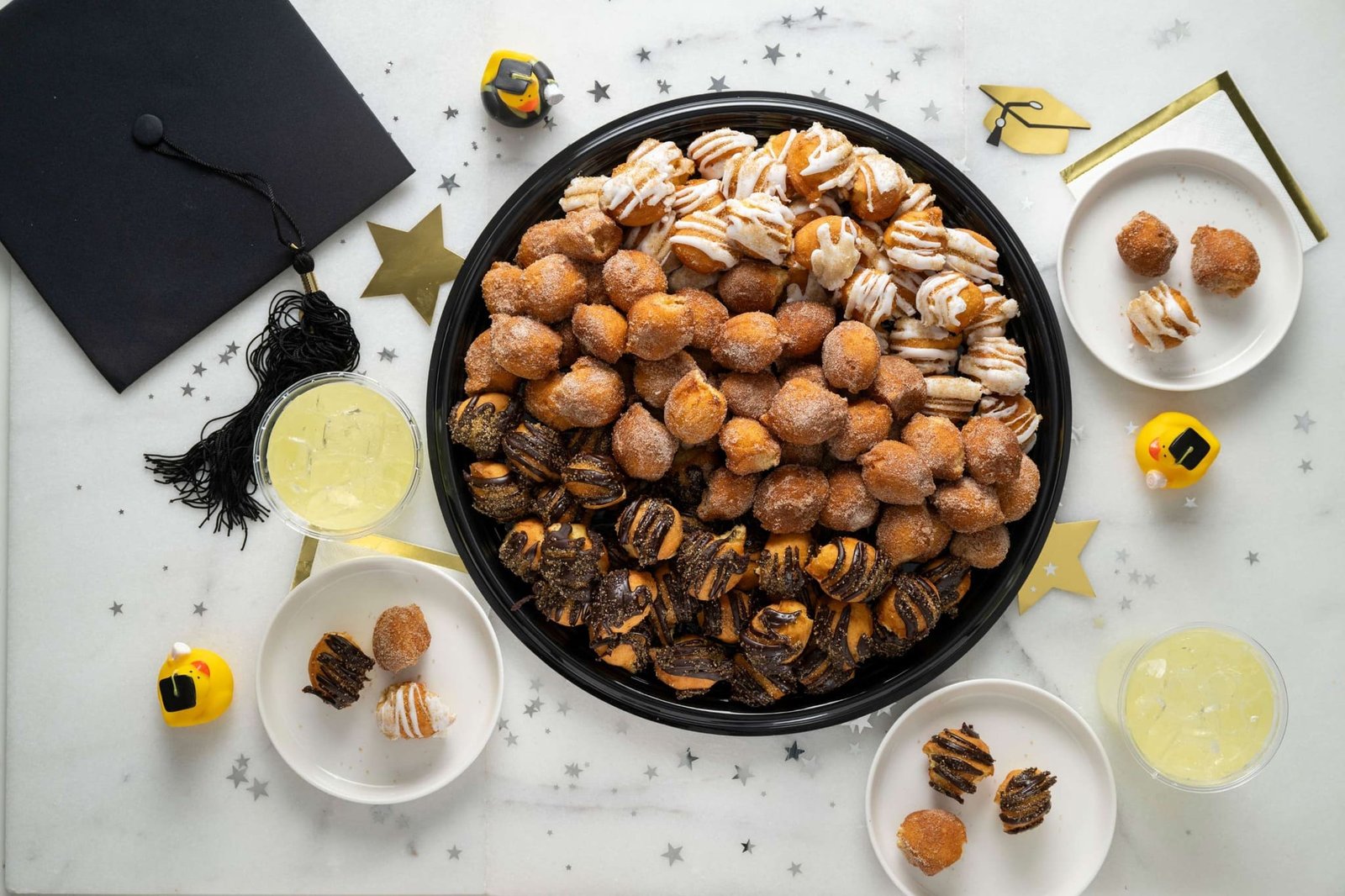 Donuts, desserts, and ice cream arranged for a corporate breakfast catering event by Duck Donuts.